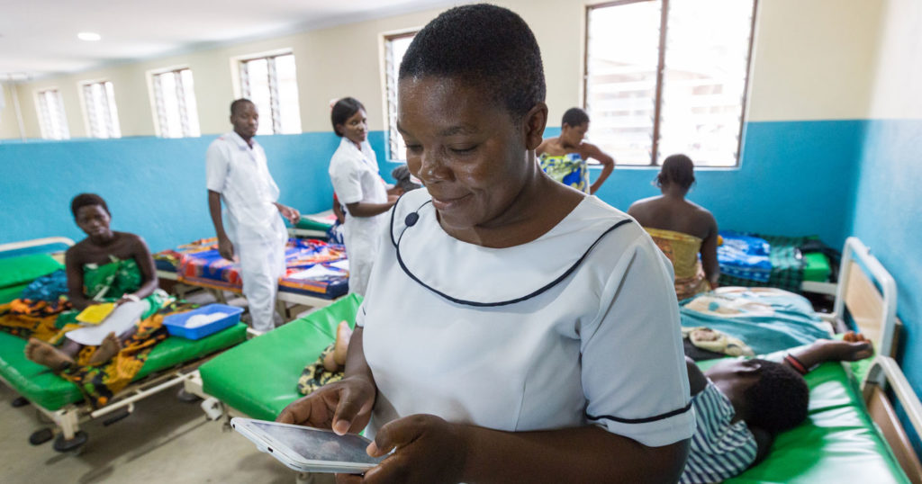 Health service worker in health center using technology in Malawi